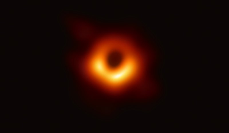 The image reveals the black hole at the center of Messier 87, a massive galaxy in the nearby Virgo galaxy cluster. This black hole resides 55 million light-years from Earth and has a mass 6.5-billion times that of the Sun.